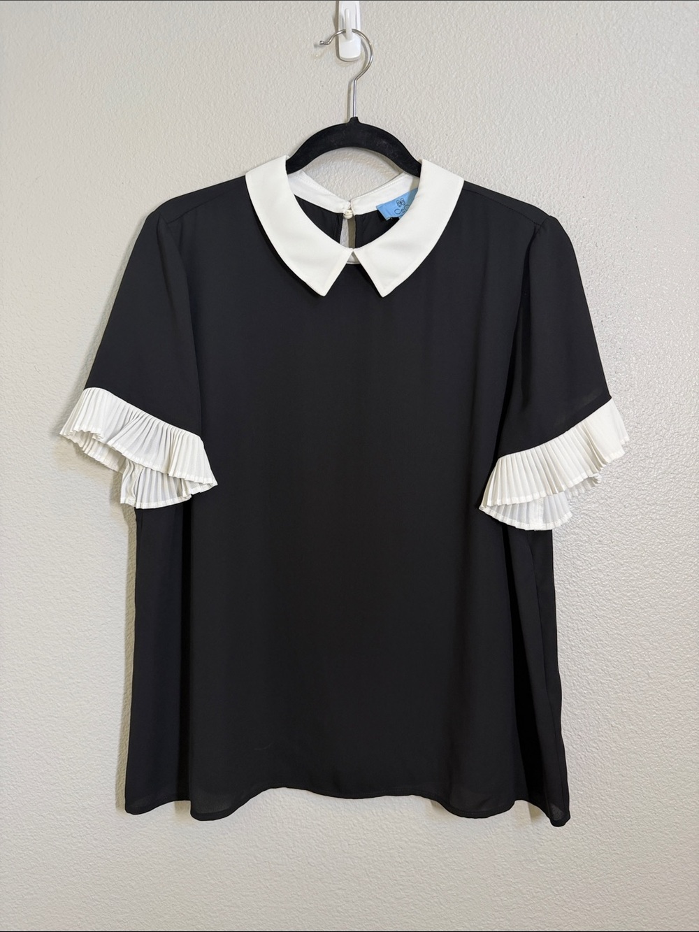 CeCe Women’s Black Blouse with White Peter Pan Collar and Pleated Sleeve Ruffles